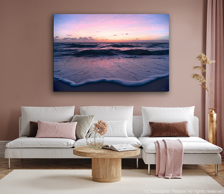 Beach sunrise print by Christopher Petsos hanging in a modern living room