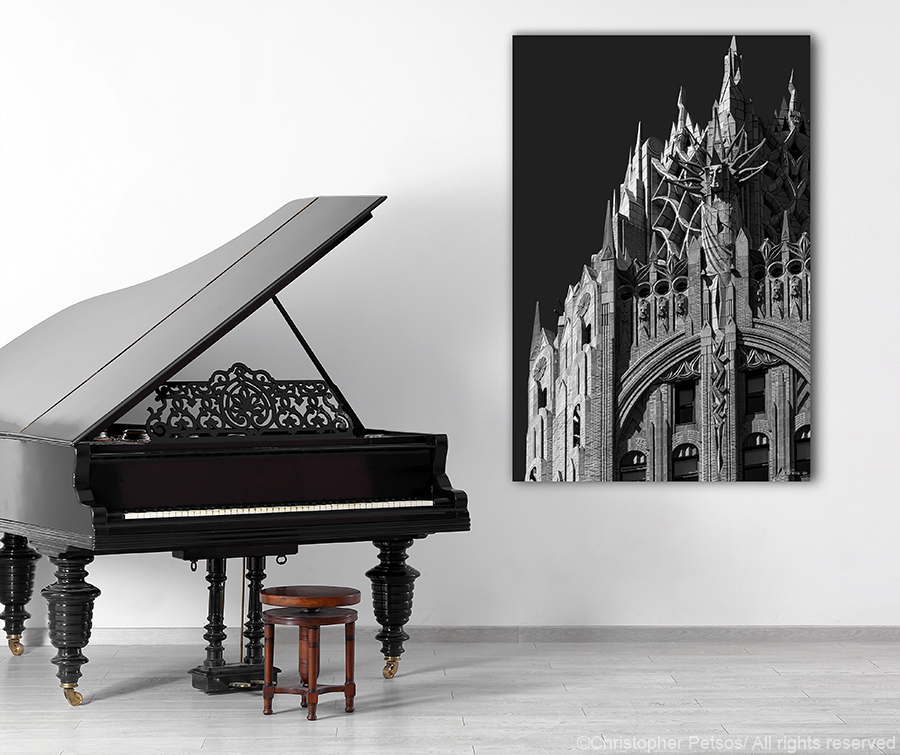 Chris Petsos limited edition print of the GE Building crown hanging next to a piano