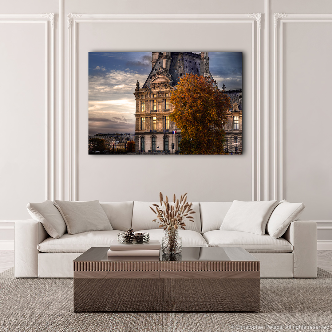 Christopher Petsos print of sunset with the Louvre museum and a tree in Autumn hanging in a living room