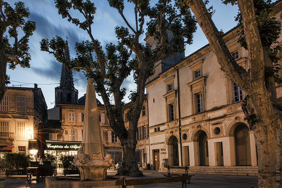 Small plaza with trees in Saint-Remy during twilight