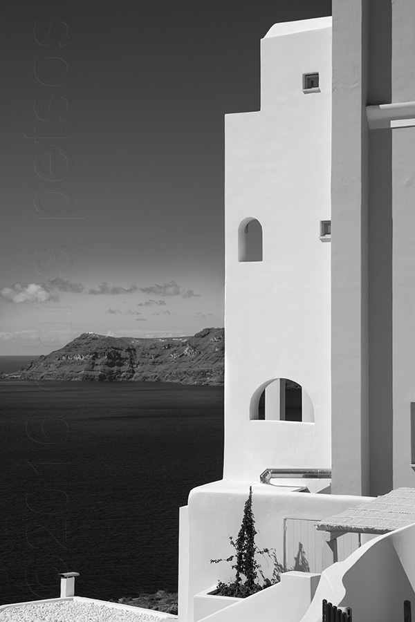 Black and white fine art print of white architecture above the water in Santorini, Greece