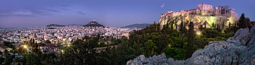 Athens panorama with the Acropolis and white buildings at night