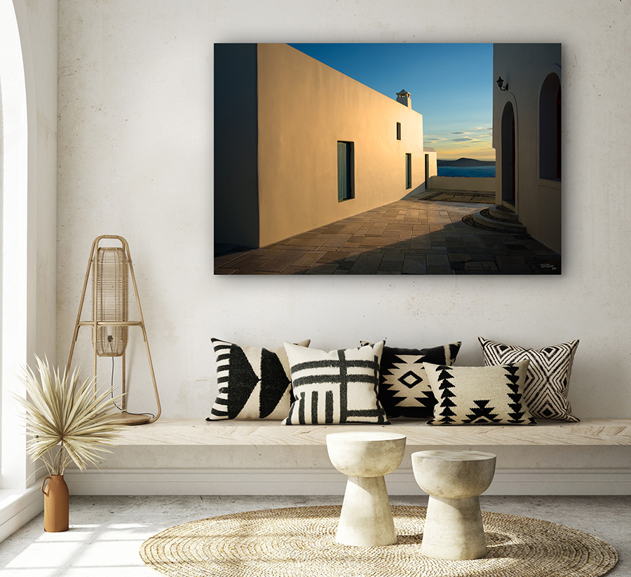 Photography print by Christopher (Chris) Petsos with light and shadows on a terrace above the water in the village of Plaka, Milos, Greece