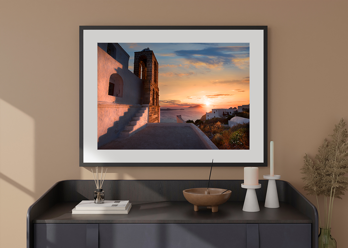 Photography print by Christopher Petsos of Milos in Greece, framed and displayed on a credenza.
