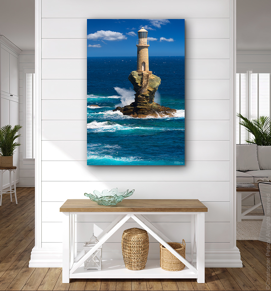 Fine art print by Christopher Petsos of the Tourlitsis Lighthouse off the island of Andros, Greece with waves of turquoise water splashing the rocks