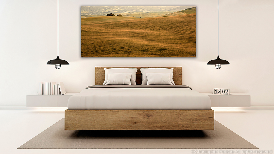 Panoramic print of wheat fields in Tuscany by Christopher Petsos in a modern bedroom