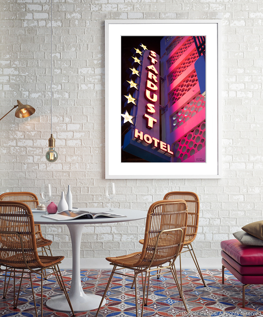 Stardust Hotel fine art print by Chris Petsos hanging in a lounge