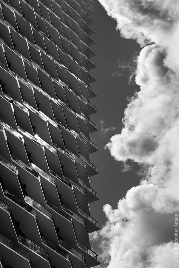 Brickell Miami apartment building Solitair with dramatic cumulus clouds by photographer Christopher Petsos