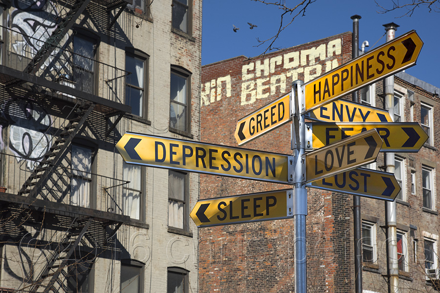 New York street signs with emotions instead of street names and typical tenement buildings in the background