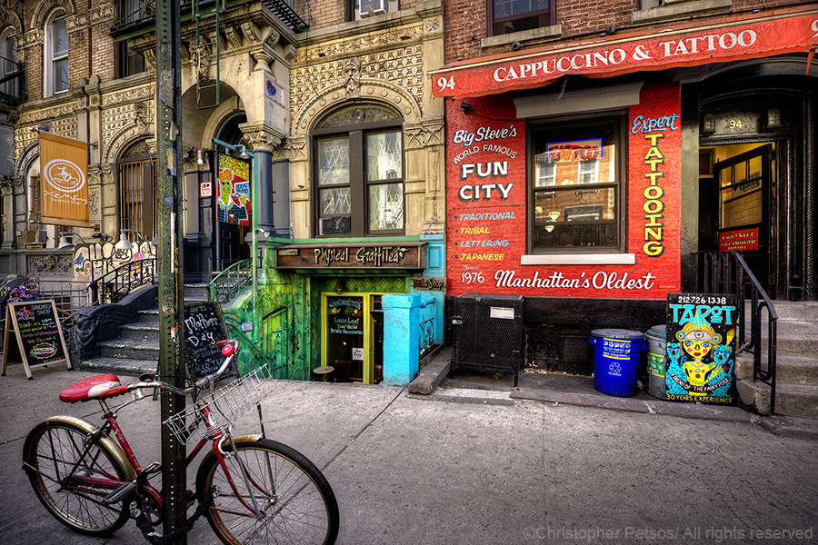 East 8th Street in New York's East Village with Cappuccino and Tattoo shop and a bicycle