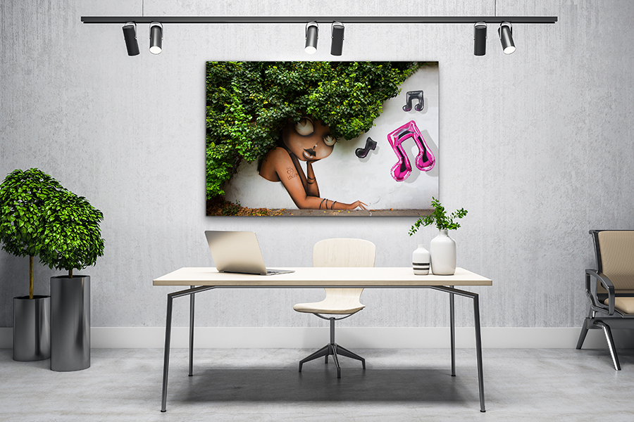 print of street art and foliage hanging in an office